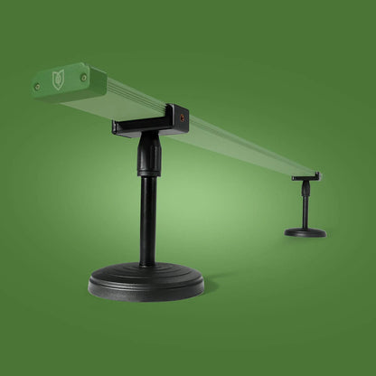 Black stand with green platform on a green background